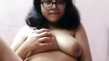 Chubby Desi girl fingering her shaved pussy
