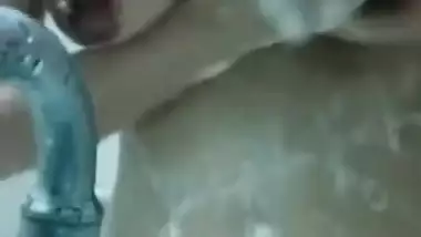 Indian girl always takes a camera when she goes to take a shower