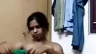 Indian MILF flashes her breasts on camera during changing in home porn