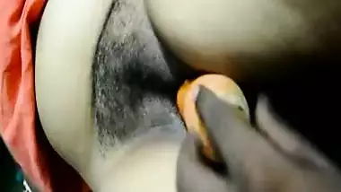 Desi bhabhi inserting carrot in pussy