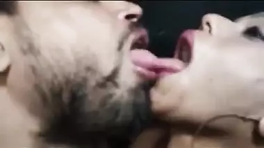 Aroused man kisses and sucks big XXX tits of naked Desi sweetheart